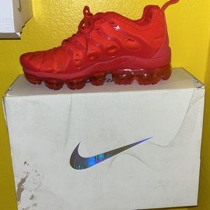 Red Nike Air VaporMax Plus.
